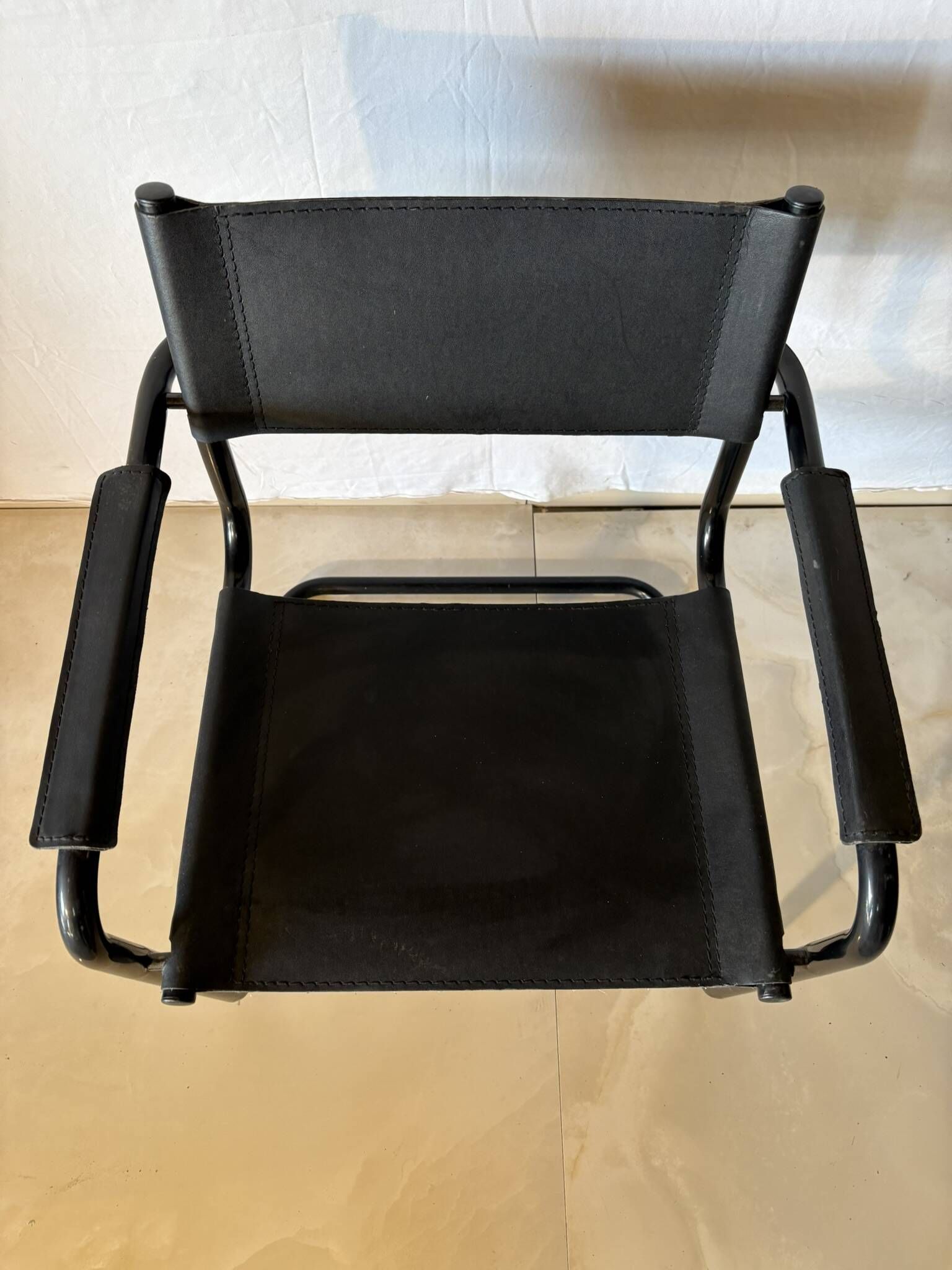 Set of 12 vintage black leather and tubular steel chairs – Italy, year