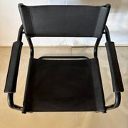 Set of 12 vintage black leather and tubular steel chairs – Italy, year