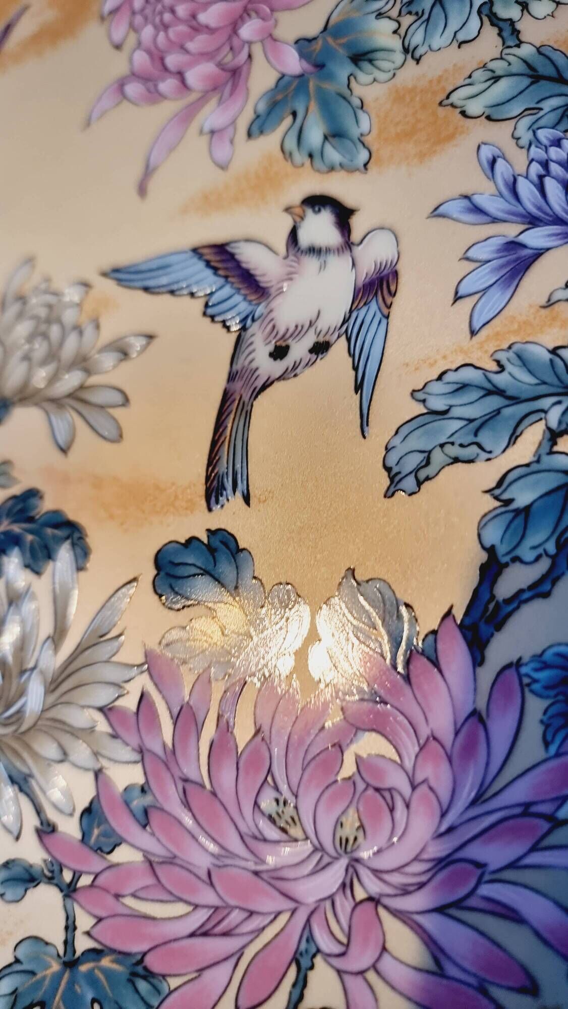Vintage Japanese decorative plate with chrysanthemum and bird patterns.