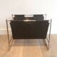 Magazine rack in brushed steel and leather, in the style of Poul Kjaerholm