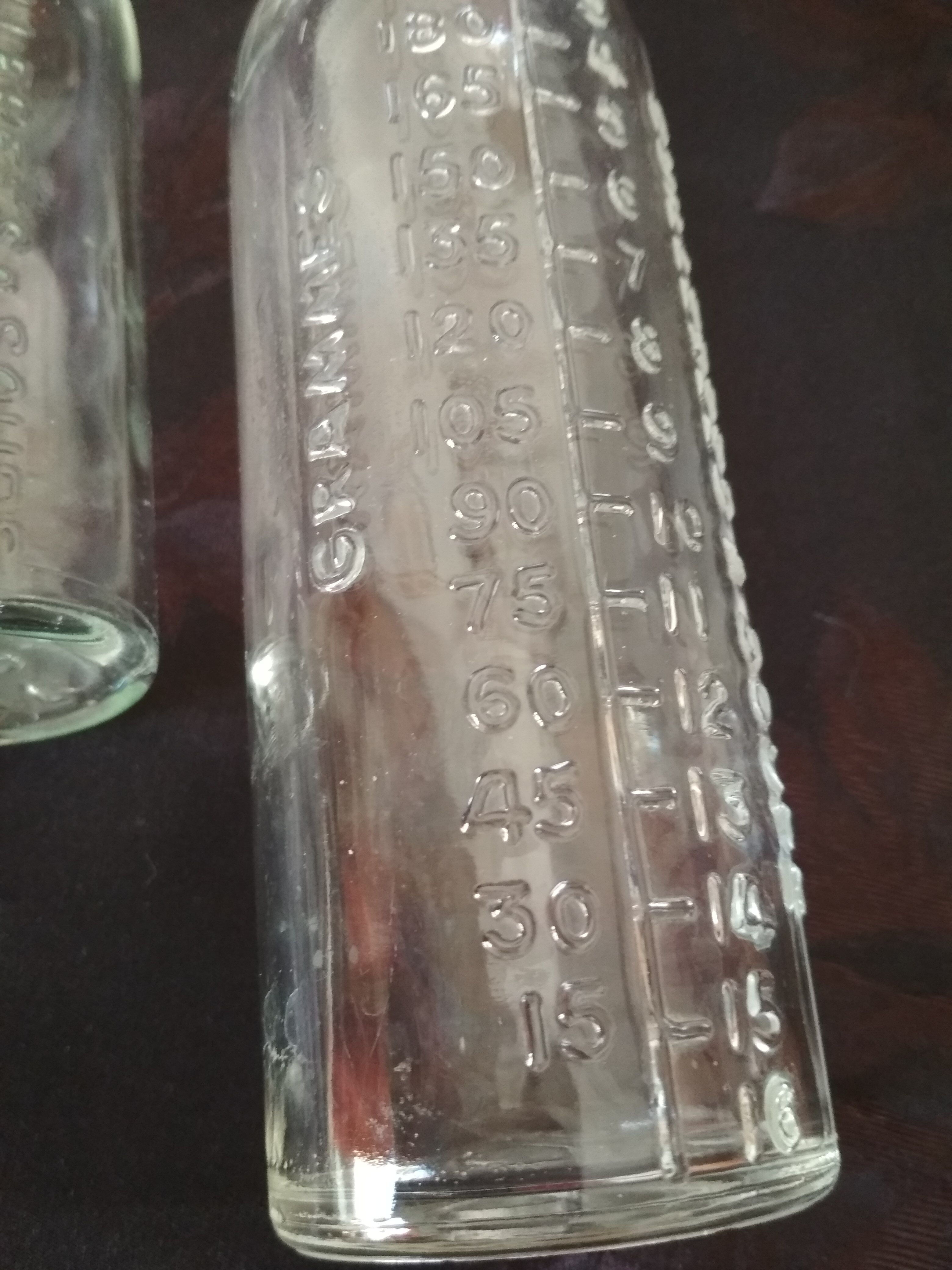 2 old graduated pharmacy bottles