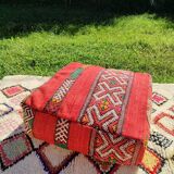 Handwoven floor pouf in natural wool