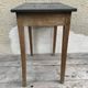 Old kitchen table in wood with compass feet