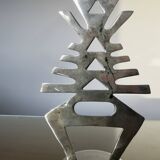 Ethnic “skeleton” candle holder in nickel-plated brass from the 80s