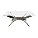A chrome-shaped table and a 70s glass tray