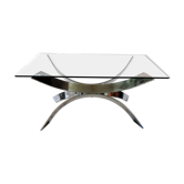 A chrome-shaped table and a 70s glass tray