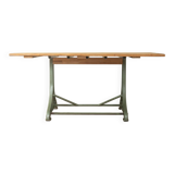 Unique dining table with cast iron base and solid wood top
