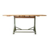 Unique dining table with cast iron base and solid wood top