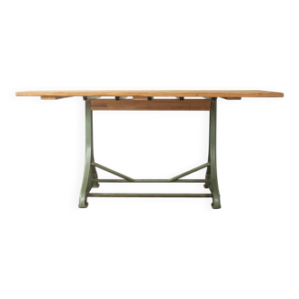 Unique dining table with cast iron base and solid wood top