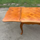 Antique extendable table in cherry wood and marquetry in the Louis XV style.
