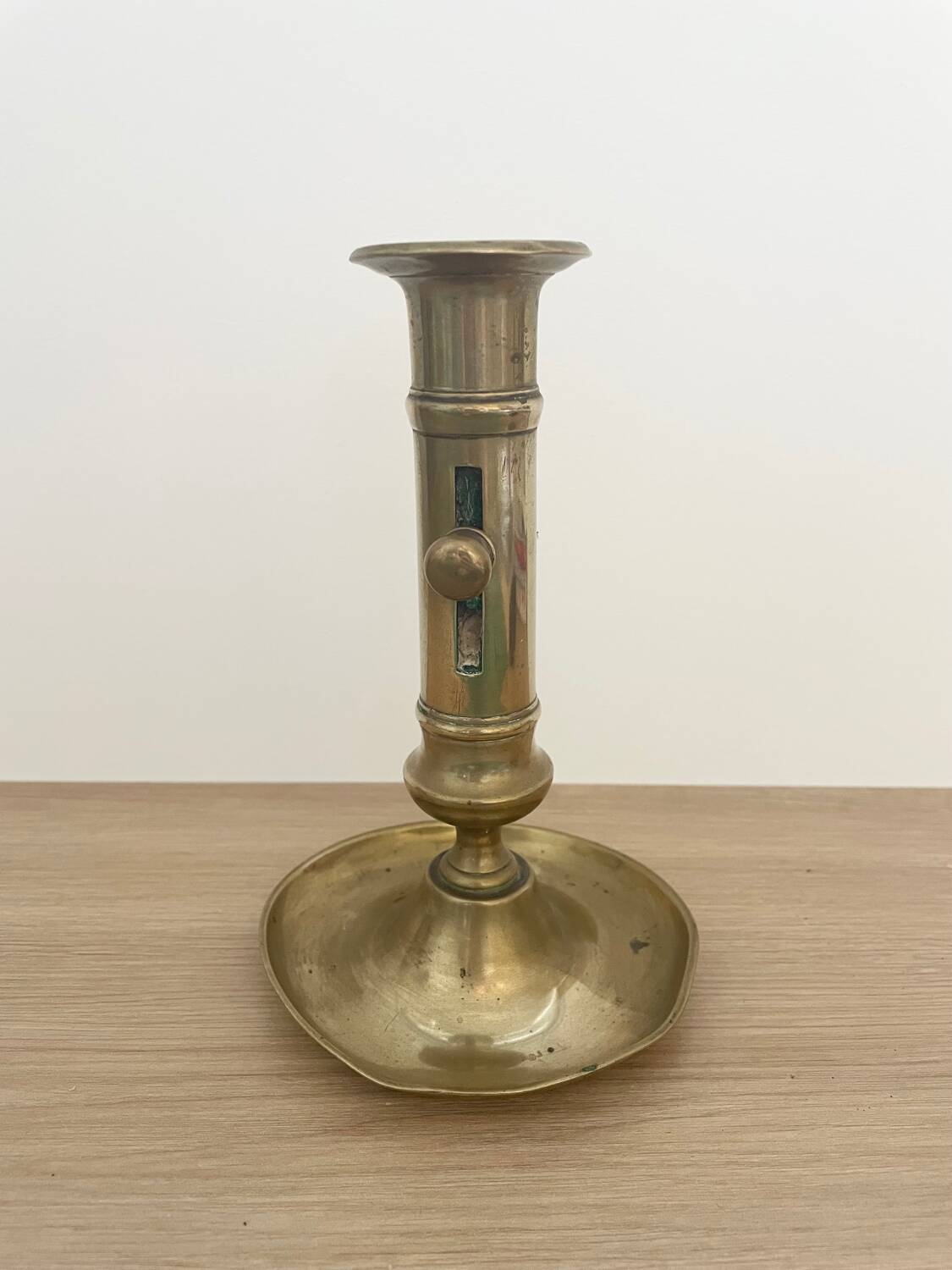 Brass candle holder with push button