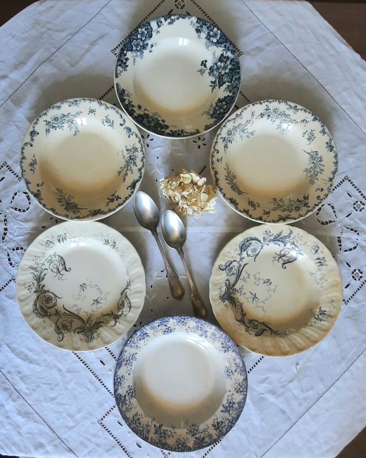 Old mismatched hollow plates in iron earth earthenware