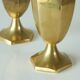 Pair of patinated brass salt and pepper shakers, 20th century.