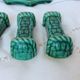 Set of 6 knife holders, a trivet, a 1960s bottle coaster