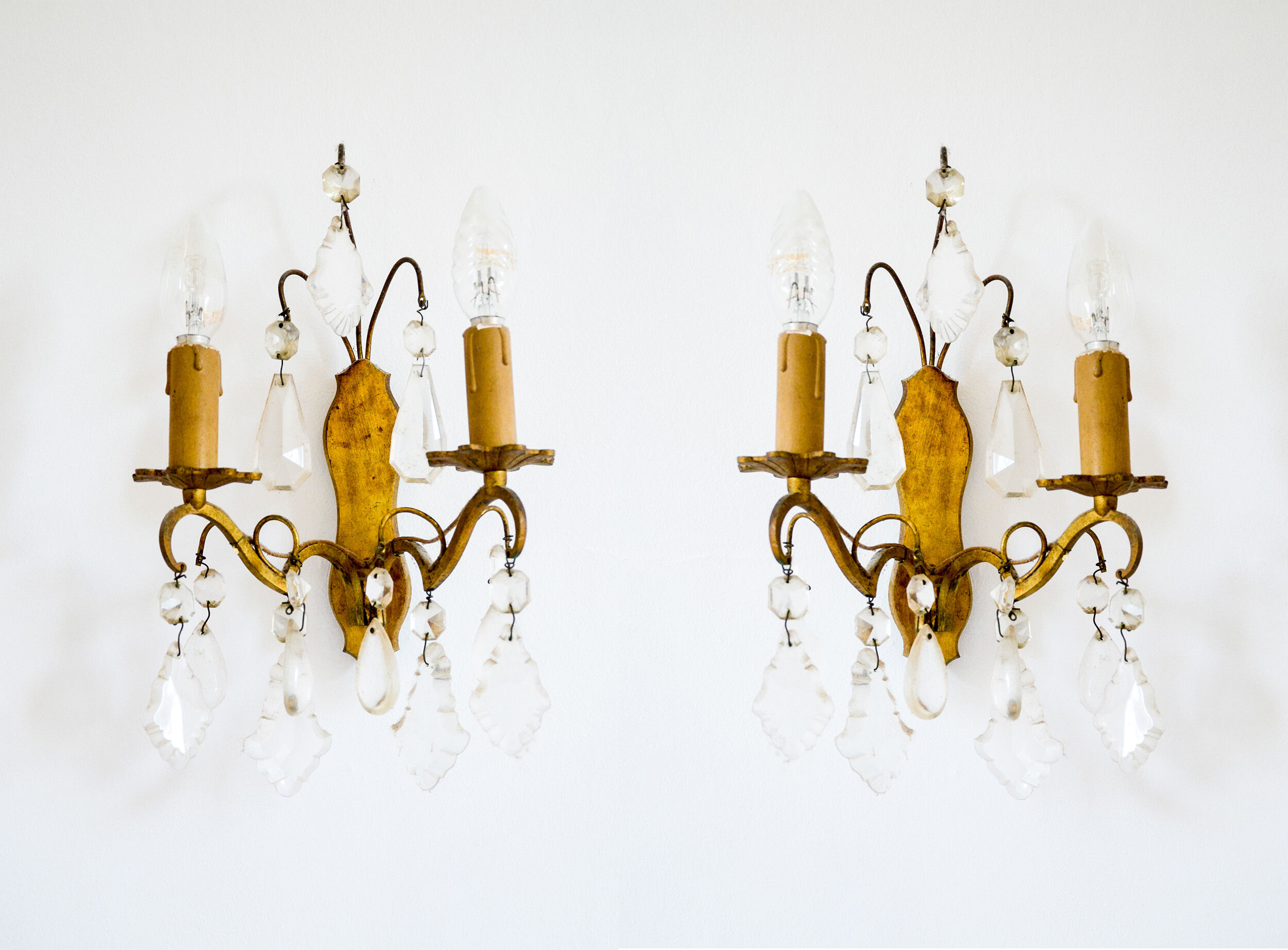 Pair of golden sconces with tassels