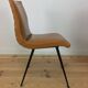 Pair of 1950s chairs with compass legs and brown faux leather.