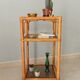 Étagère vintage en bambou, rotin et verre fumé années 70/80