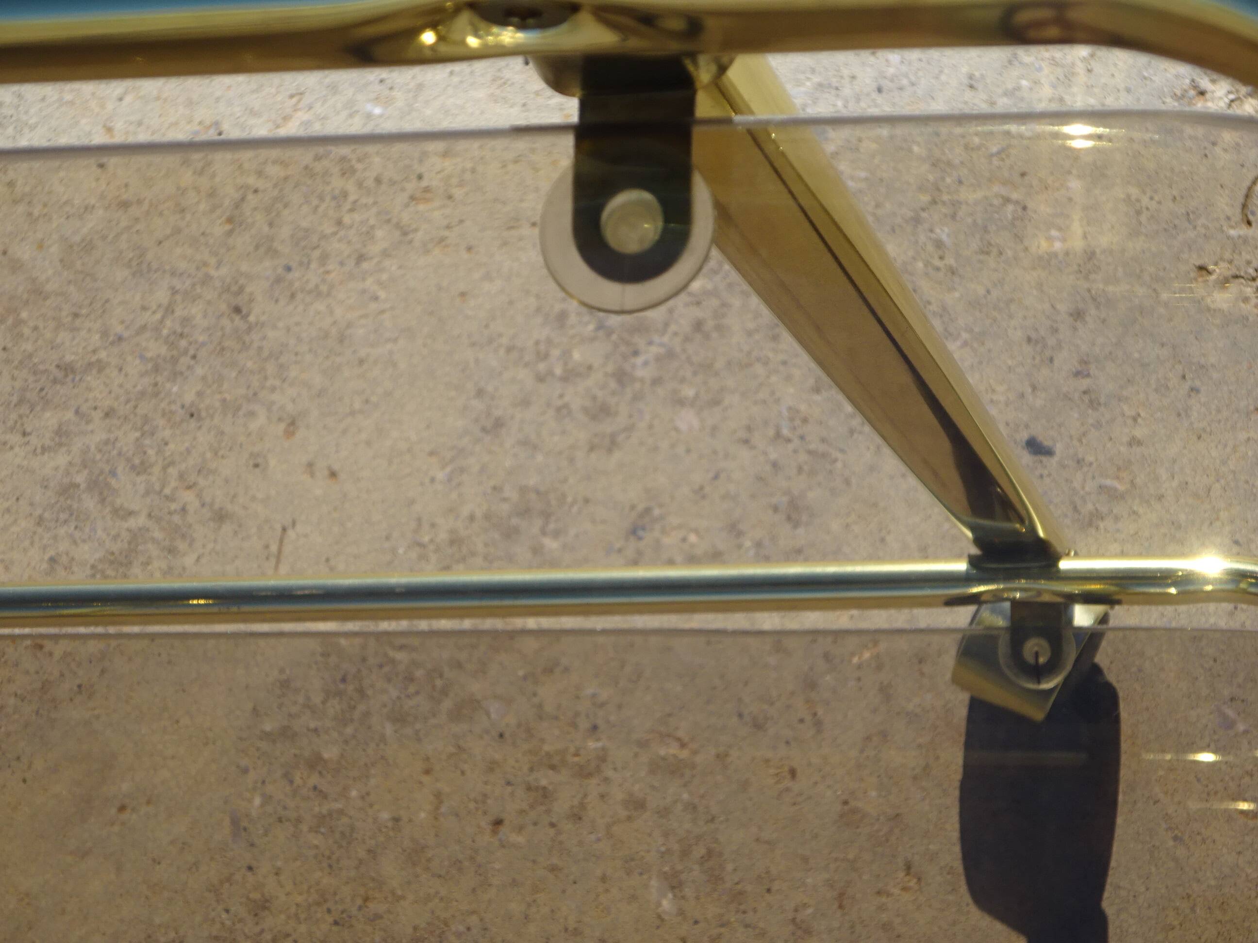 Golden metal and smoked glass dessert table