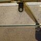 Golden metal and smoked glass dessert table