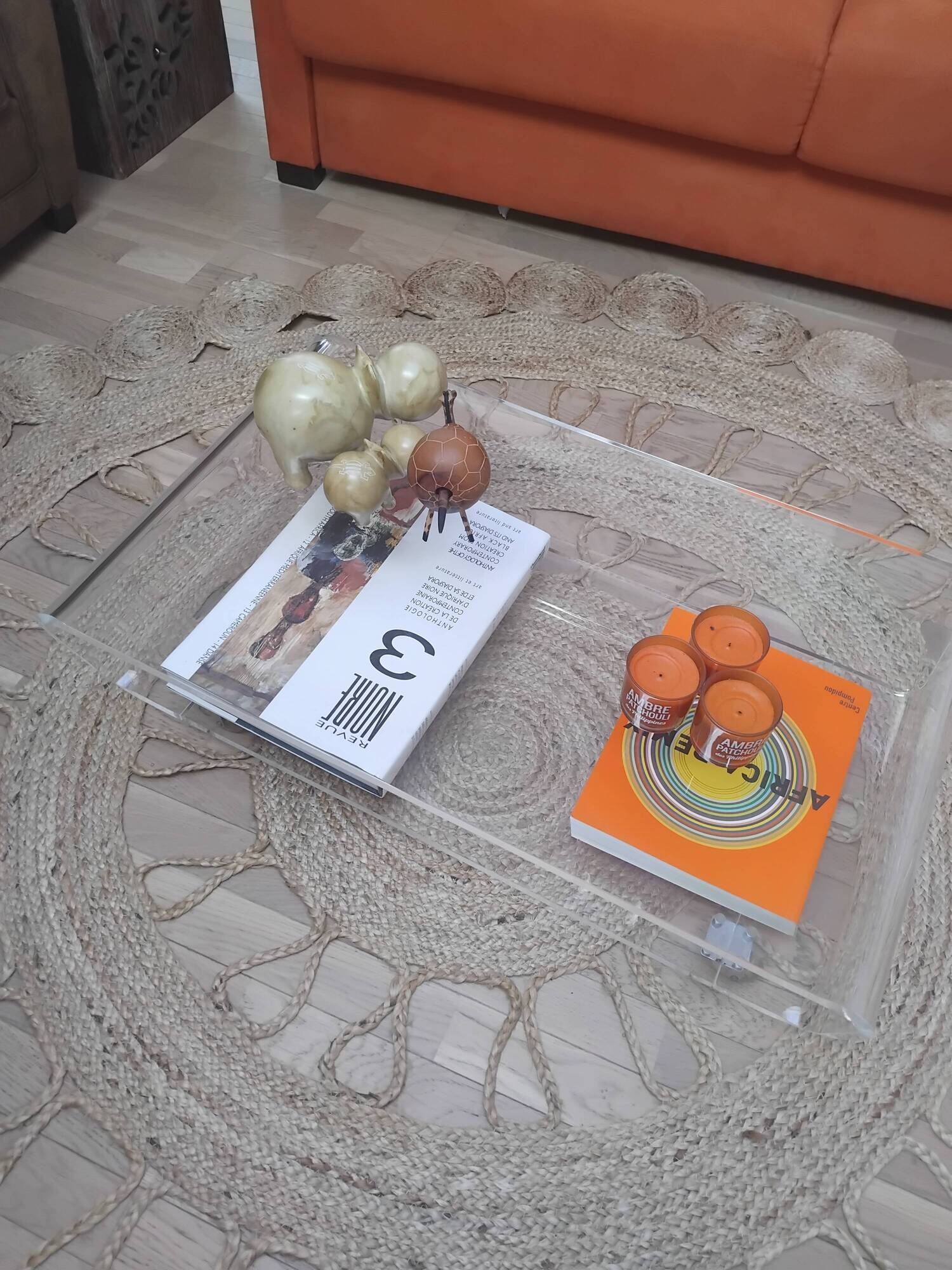Design coffee table from Habitat in transparent plexiglass, mounted on wheels.