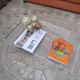 Design coffee table from Habitat in transparent plexiglass, mounted on wheels.