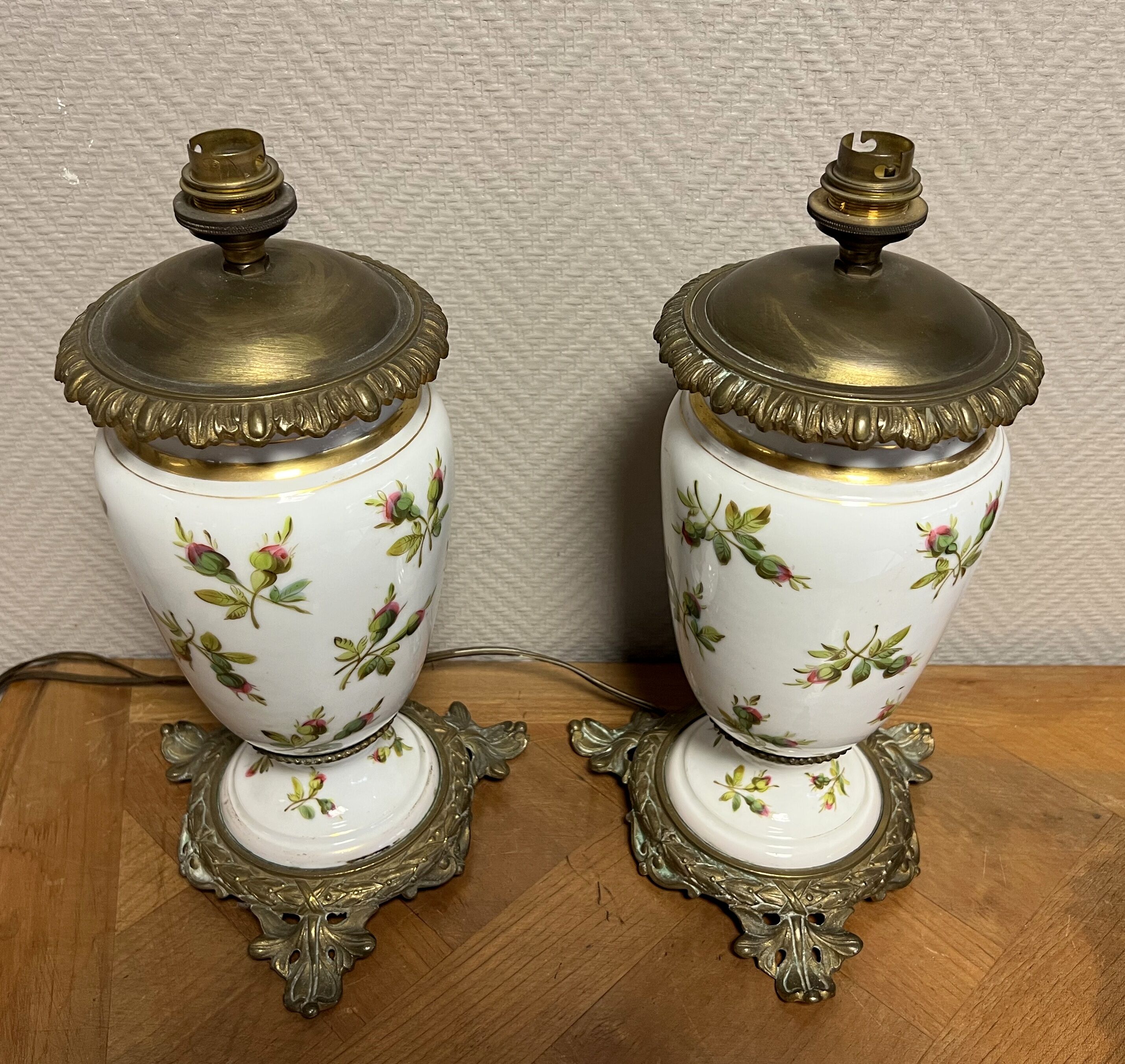 Old pair of porcelain oil lamps decorated circa 1900