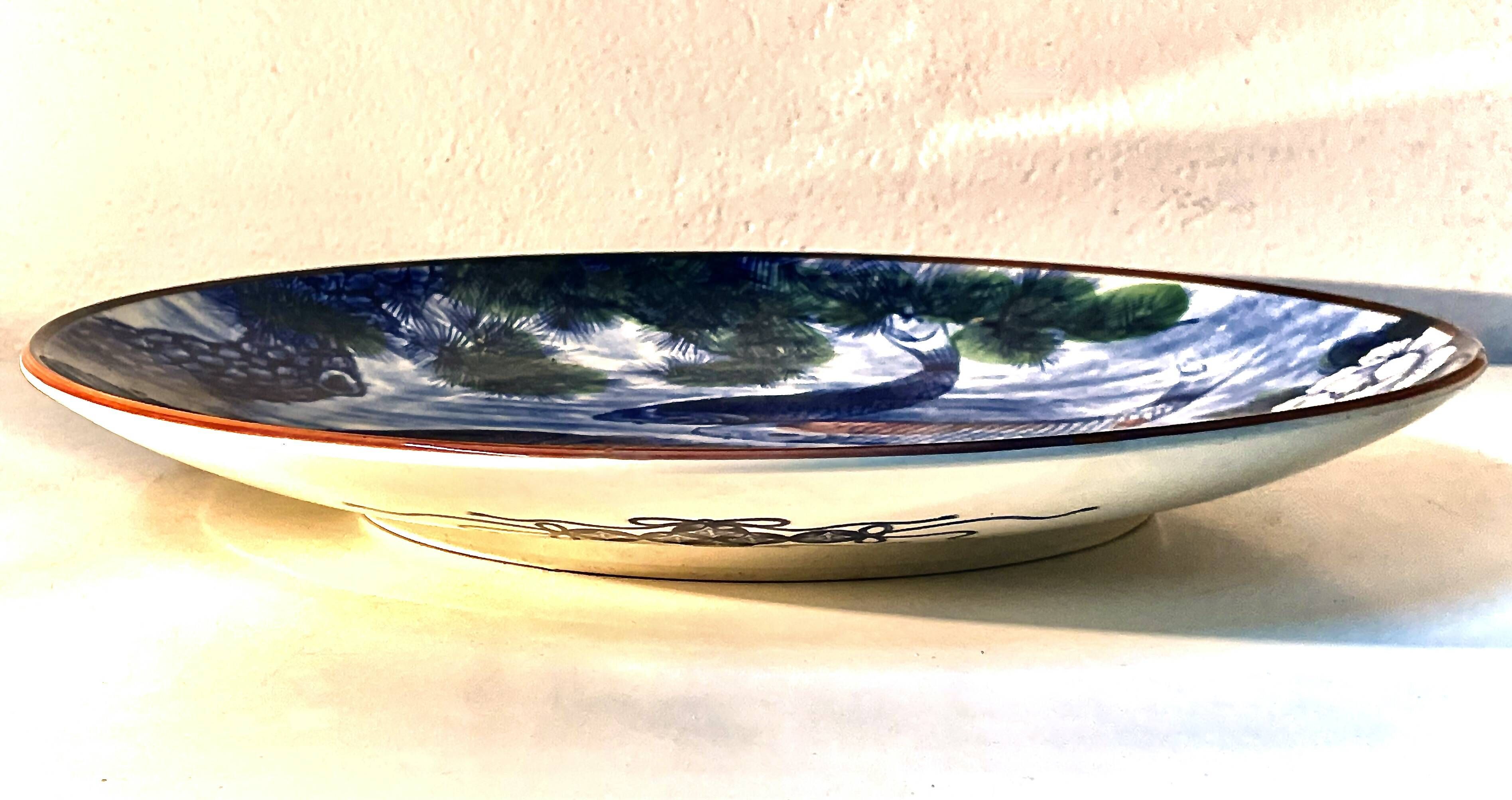 Decorative porcelain plate featuring a koi carp.
