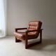 Vintage lounge chair in teak and leather from the 1960s.