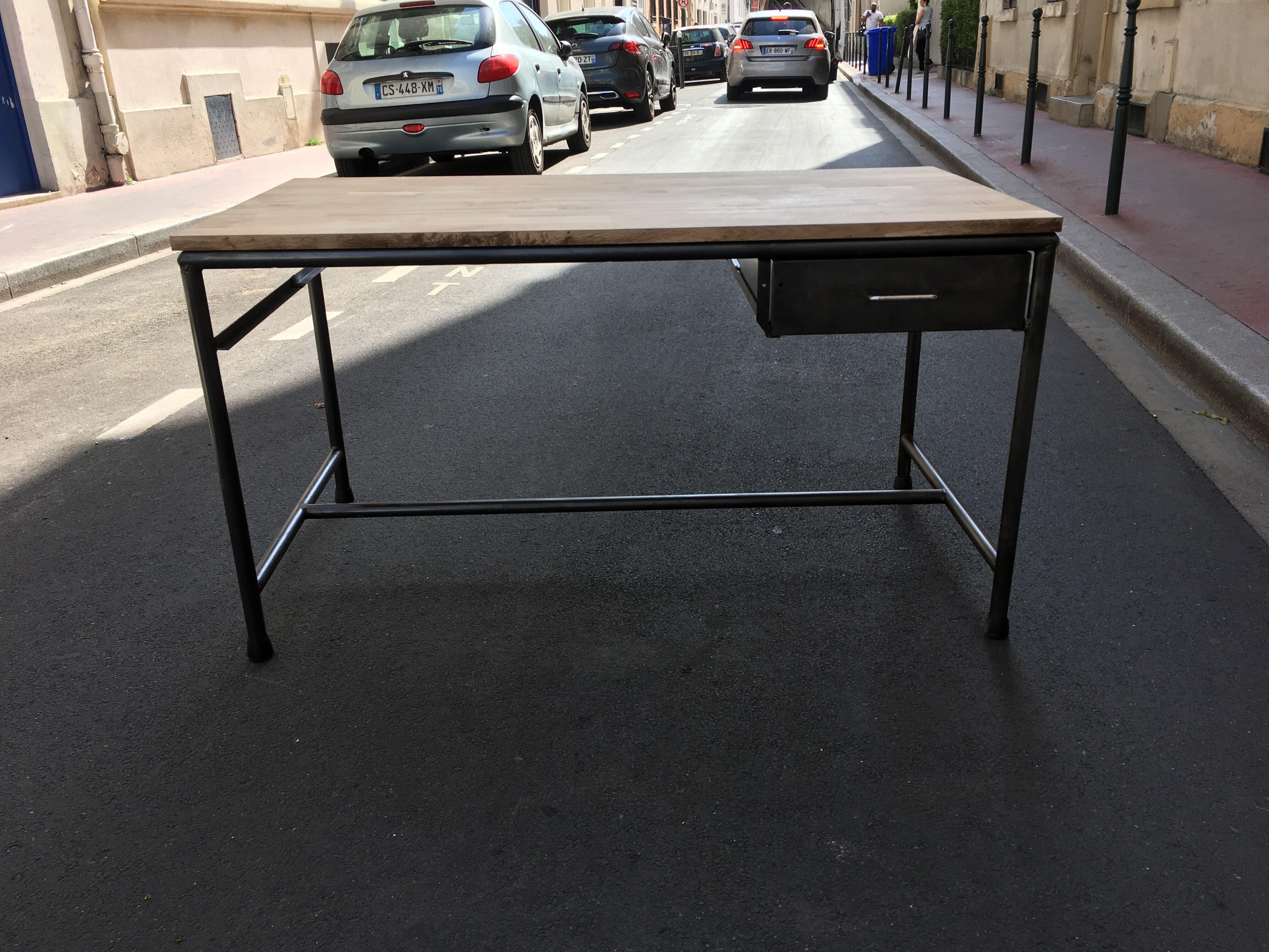 Metal desk on wood circa 1950