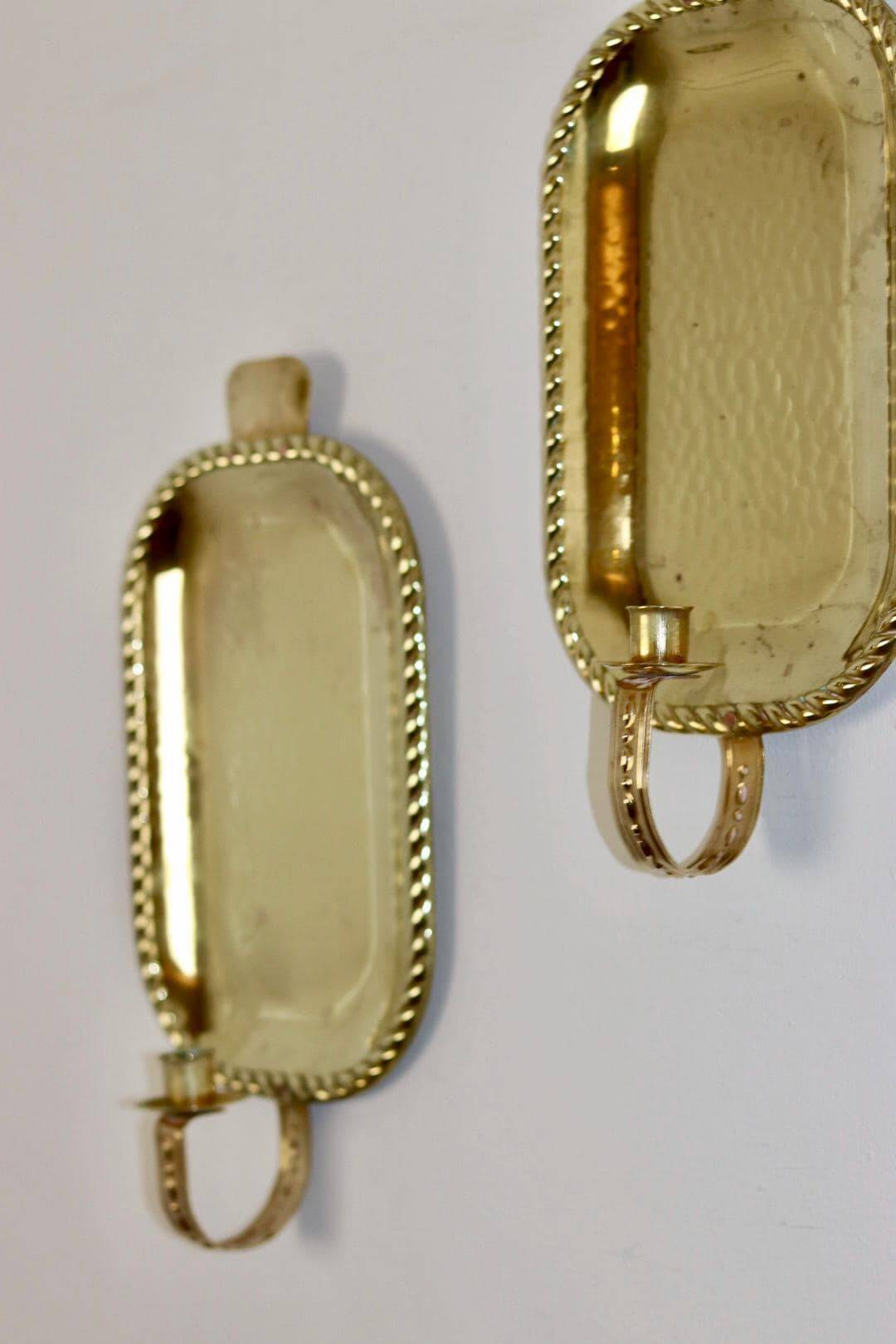 Pair of Swedish brass wall sconces from the mid-century.