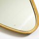 Heavy mid-century brass kidney-shaped wall mirror from Münchner Zierspiegel