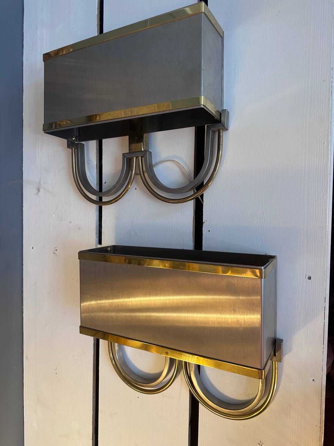Pair of stainless steel and brass wall lights