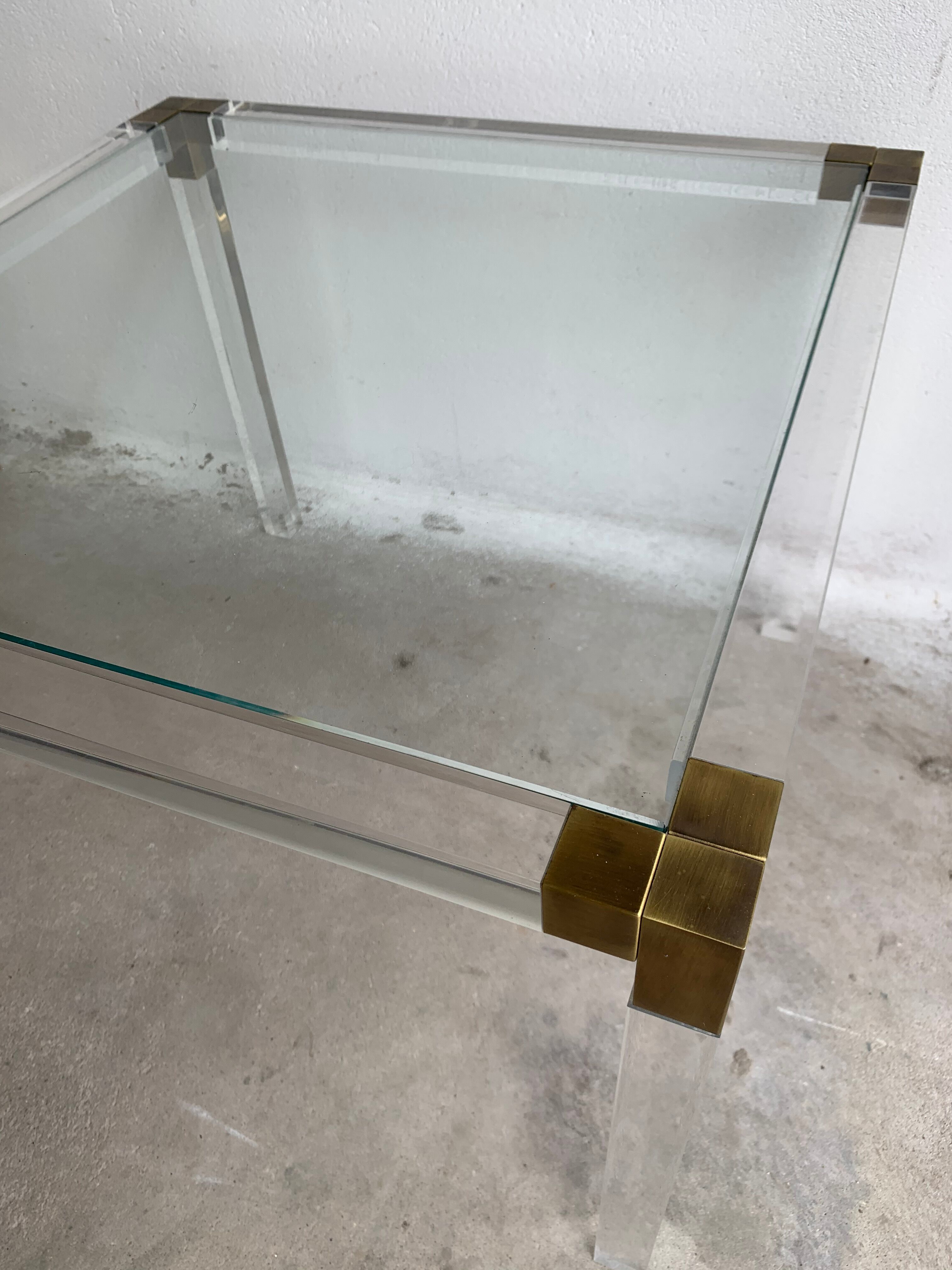 Lucite and brass coffee table by Charles Hollis Jones