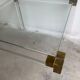 Lucite and brass coffee table by Charles Hollis Jones