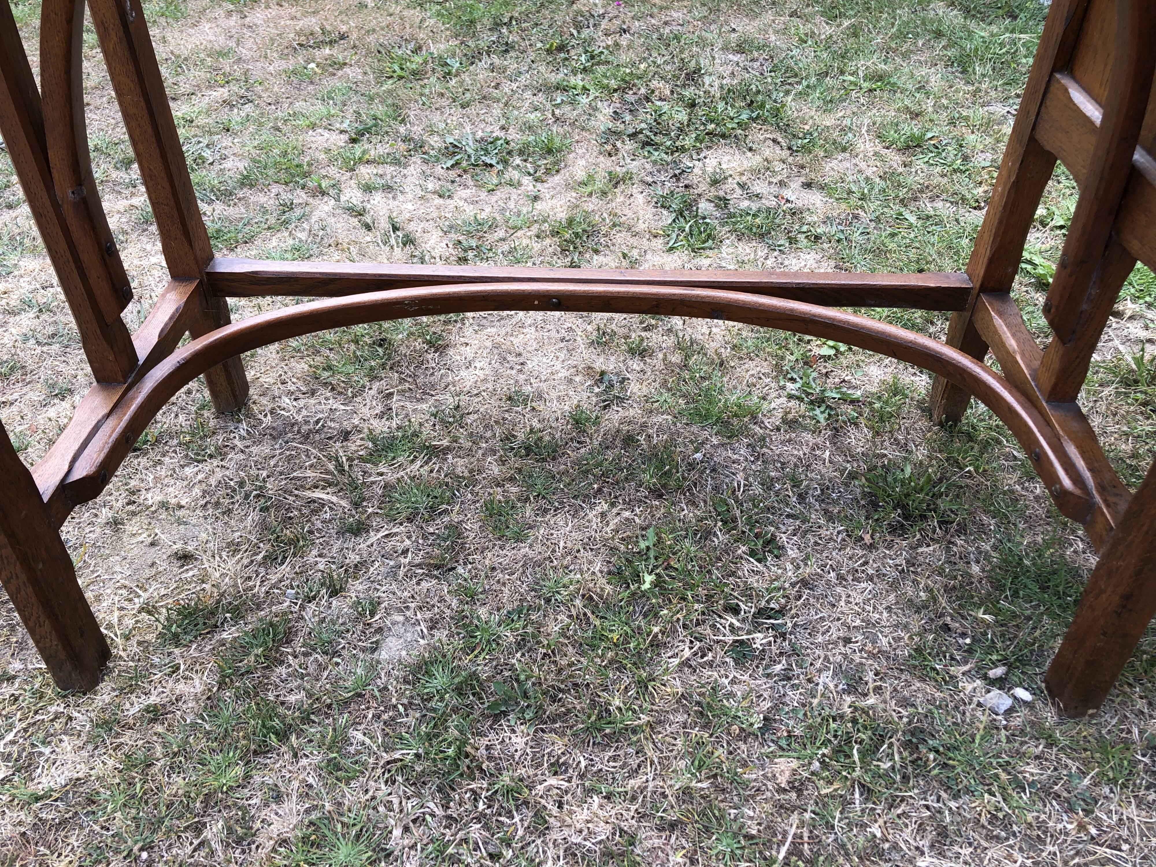 Old oak desk with curved wooden sleepers in the Art Nouveau spirit of the early 20th century.