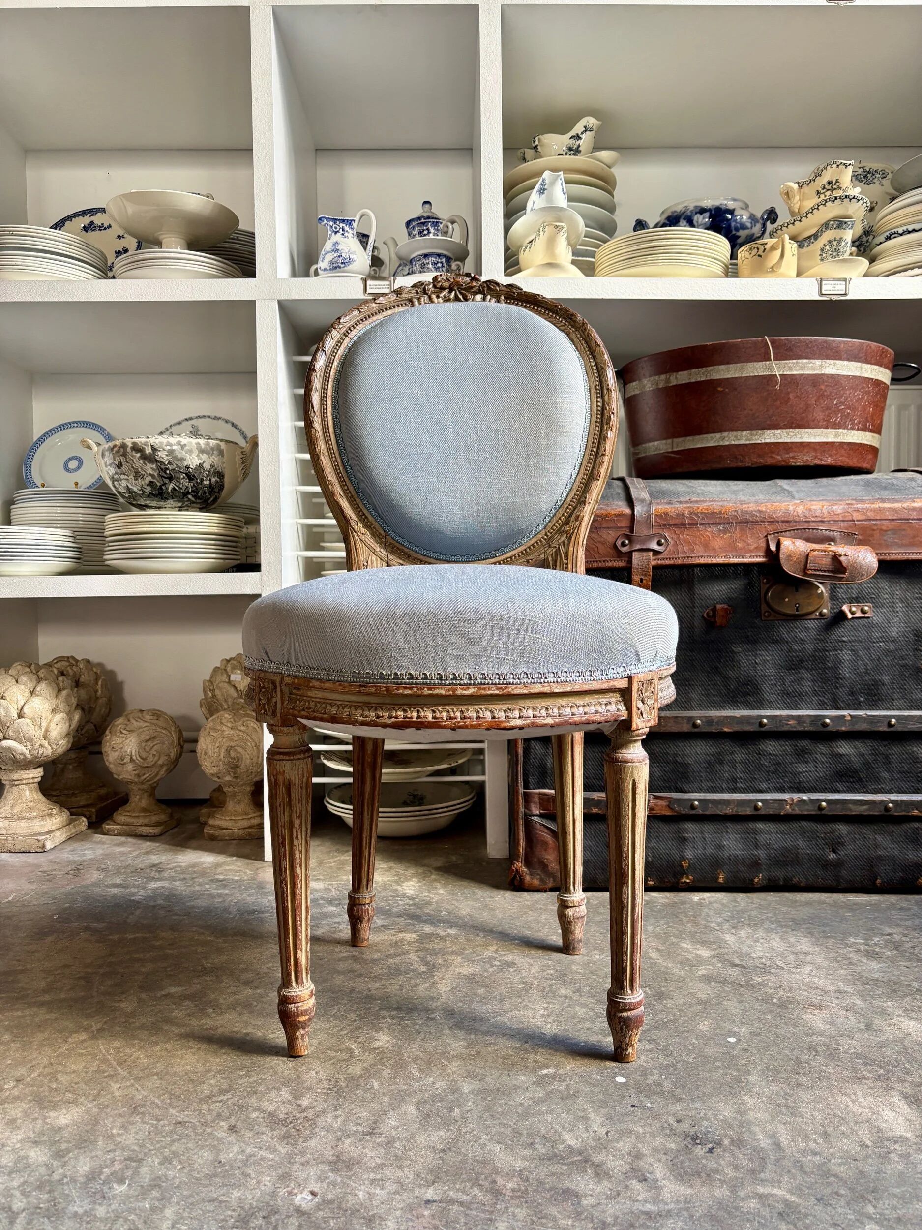 Medallion back chair in reclaimed wood and blue cotton.
