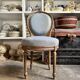 Medallion back chair in reclaimed wood and blue cotton.