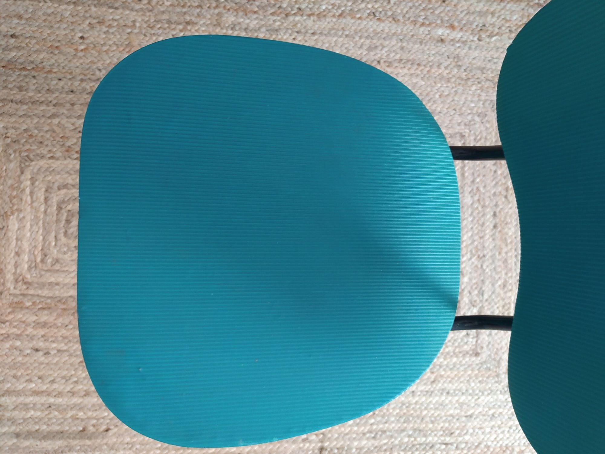 Vintage chair in turquoise green vinyl with black metal legs