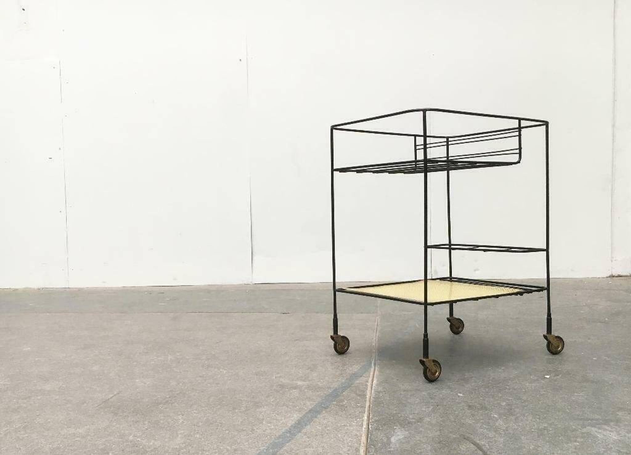 Minimalist perforated metal serving trolley in mid-century style, 1960s.