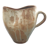 Beige stoneware pitcher with white drips