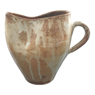 Beige stoneware pitcher with white drips