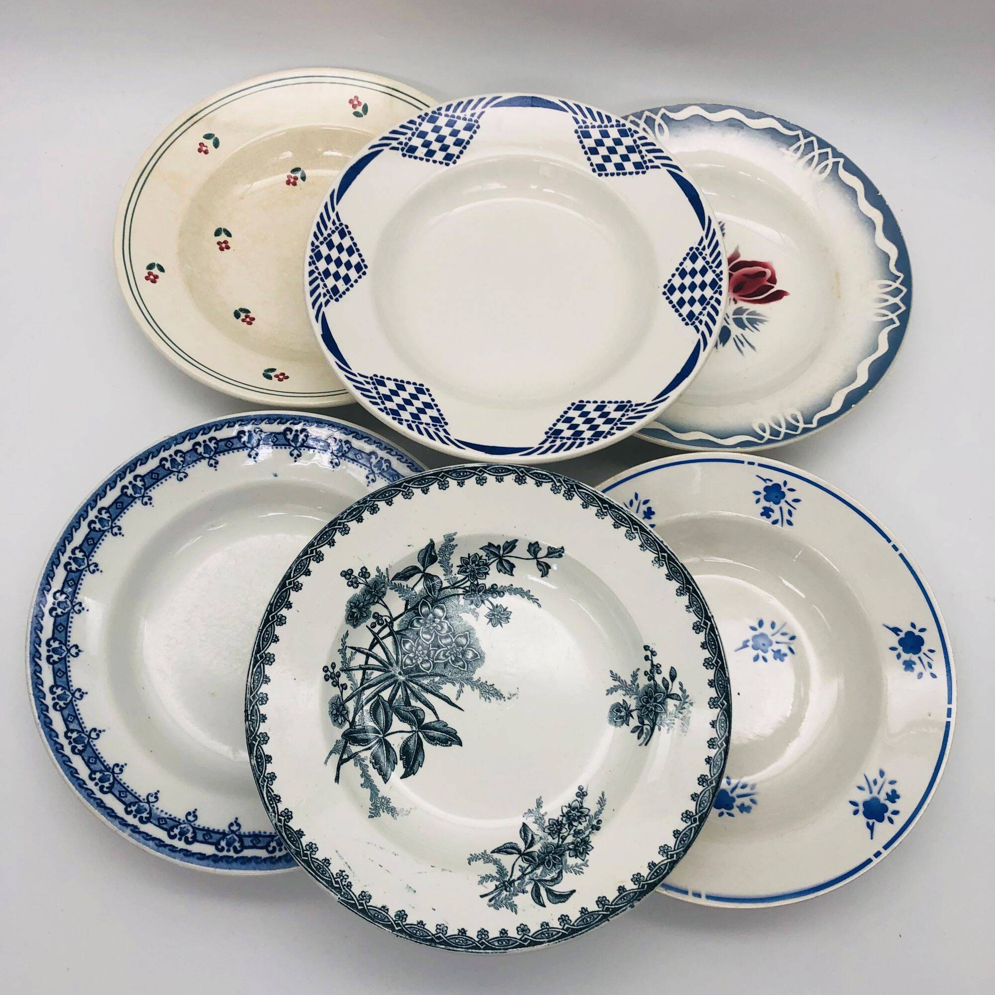 Set of 6 mismatched deep plates.