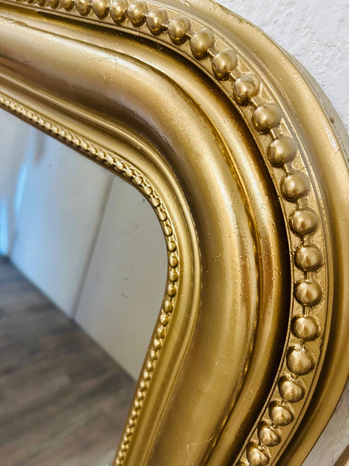 Antique gilded mirror in old Louis Philippe wood