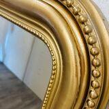 Antique gilded mirror in old Louis Philippe wood