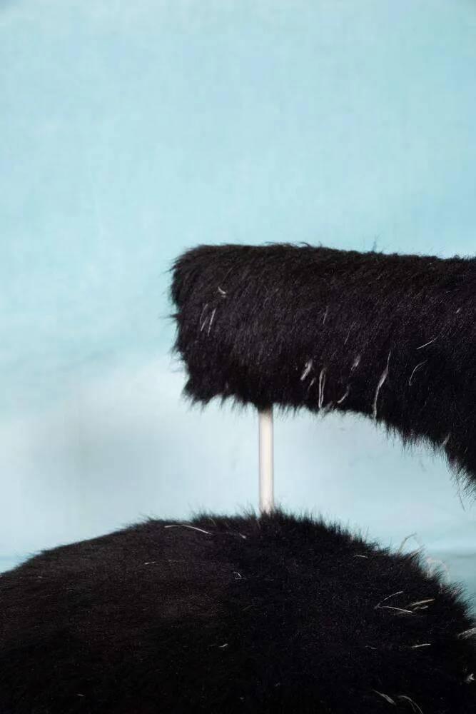 Space age design armchair from the sixties, fluffy stool with trumpet base.