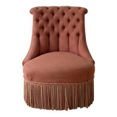 Vintage tufted armchair in old rose fabric.