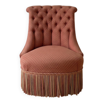 Vintage tufted armchair in old rose fabric.