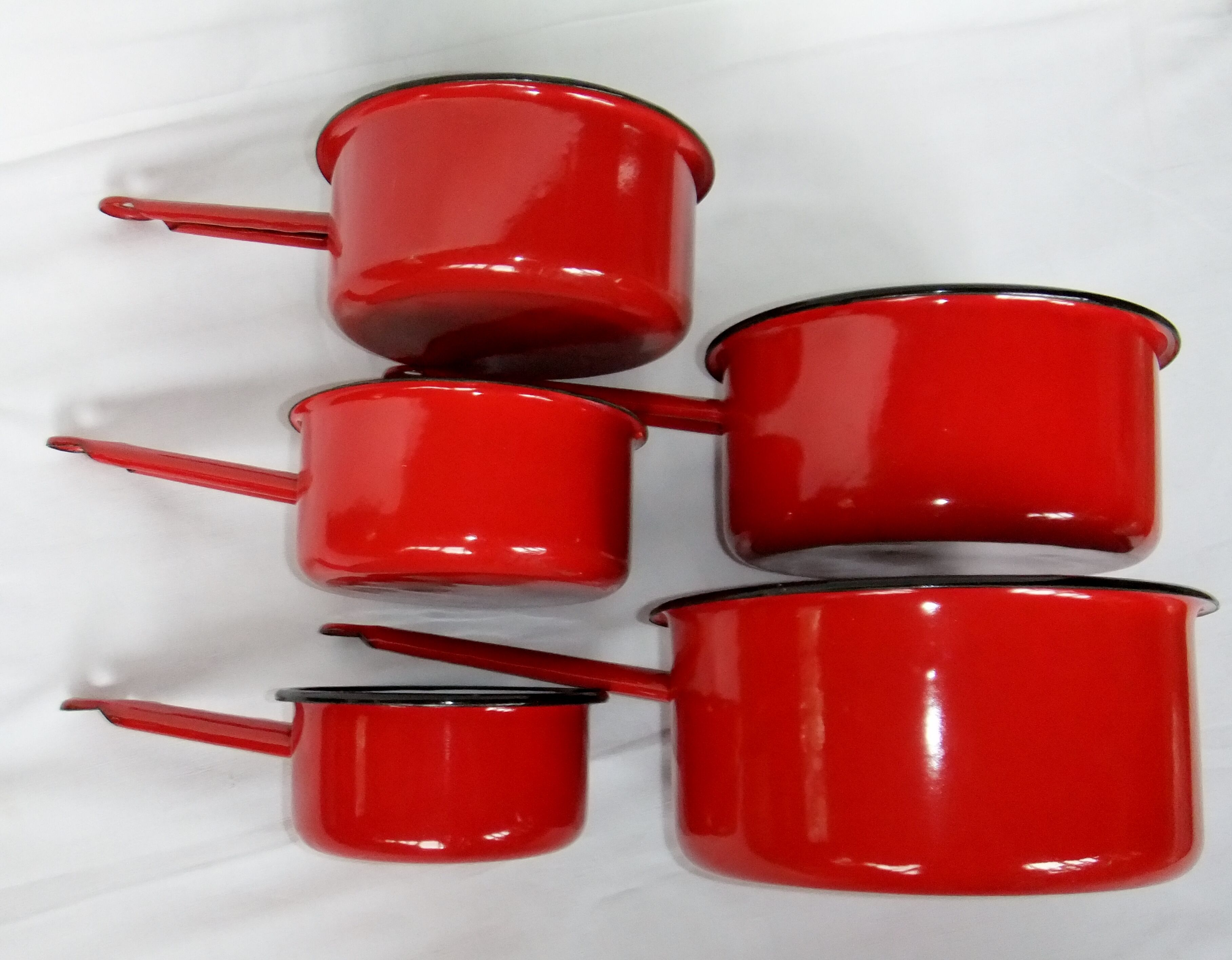 Red enamelled sheet metal pans
