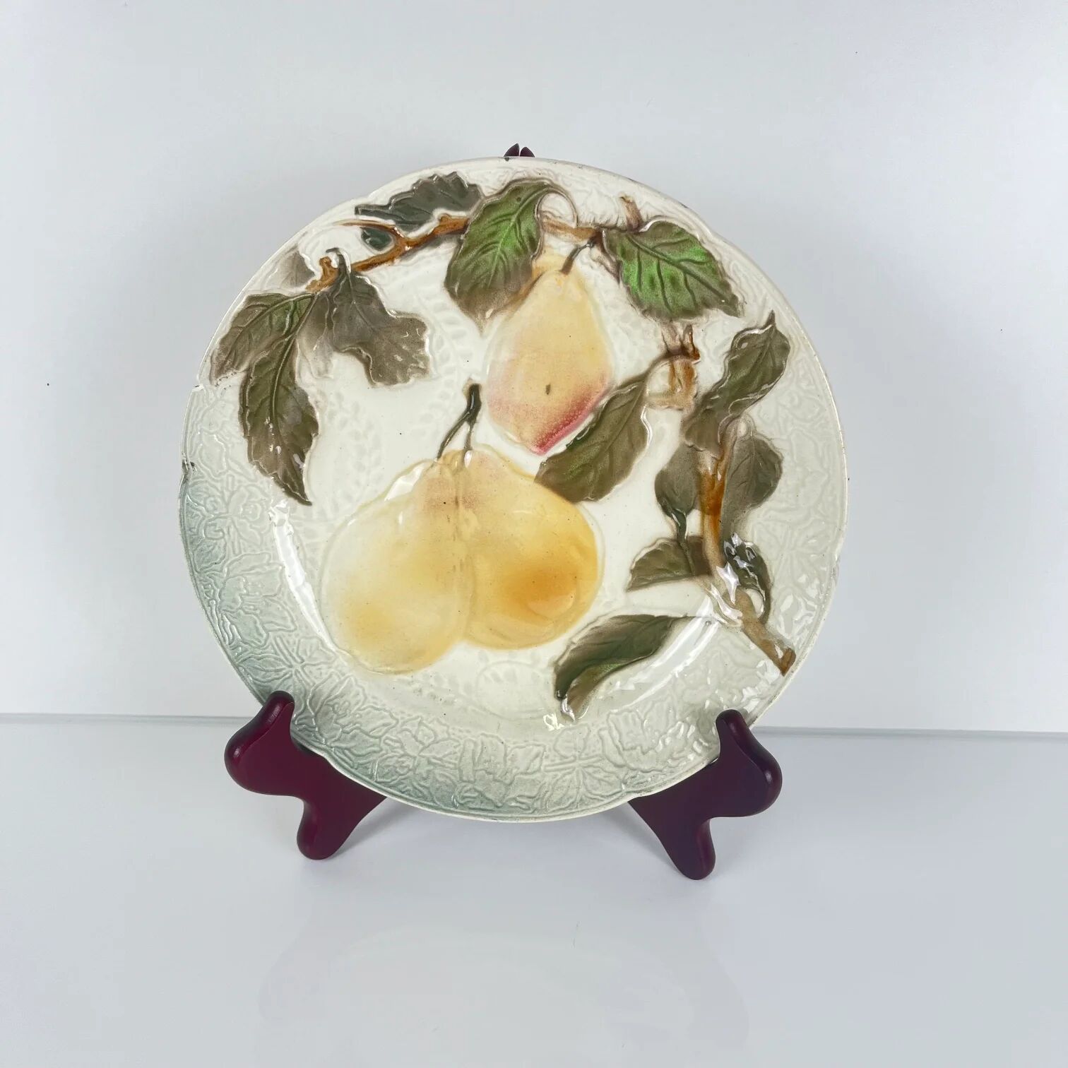 Set of 4 plates KG St Clément barbotine fruit (cherry, mirabelle, grape, pear), late 19th-early 20th century.