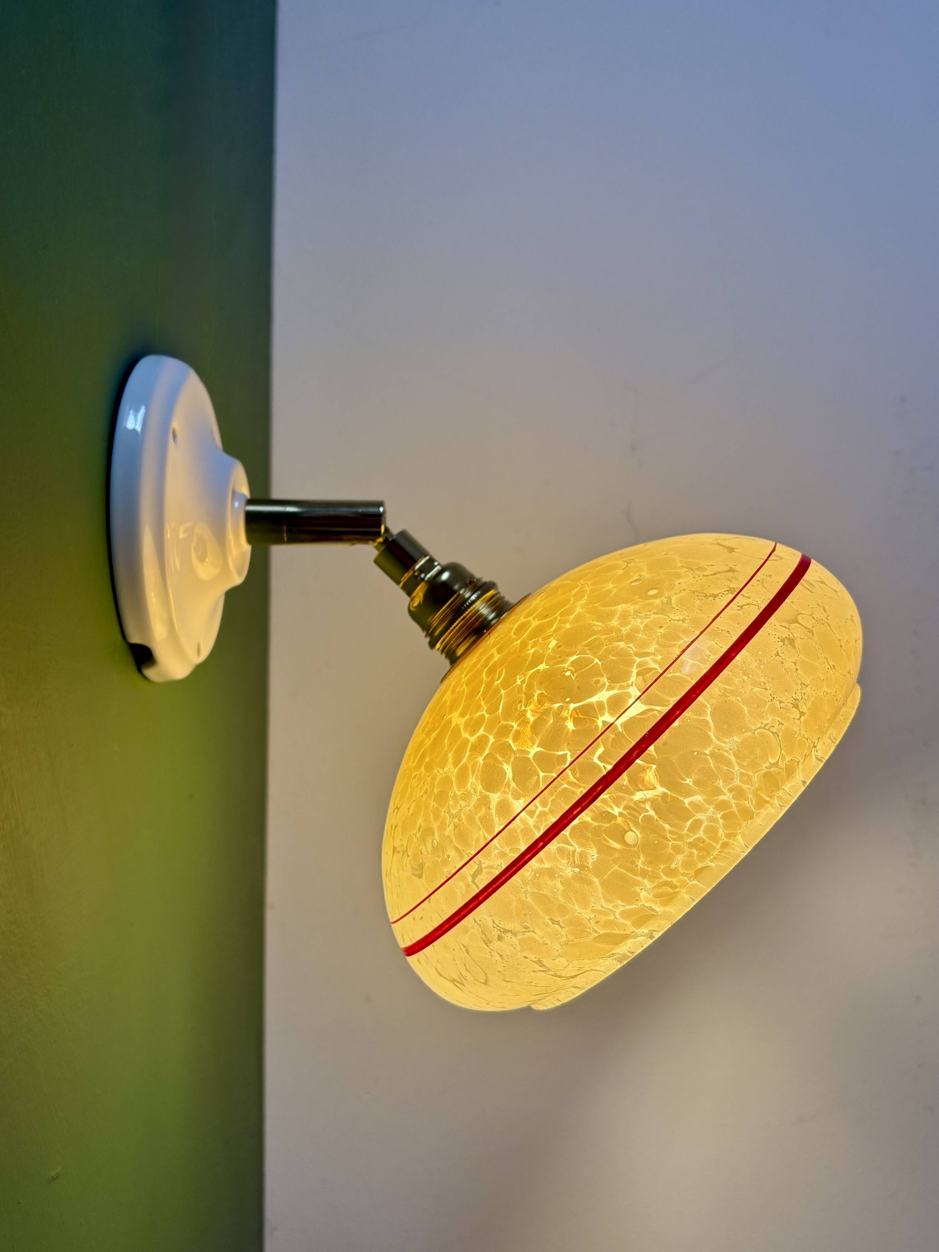 Vintage wall lamp with yellow clichy glass shade and red trim